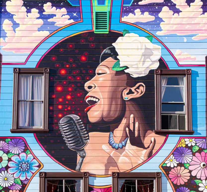 A mural of Billie Holiday singing