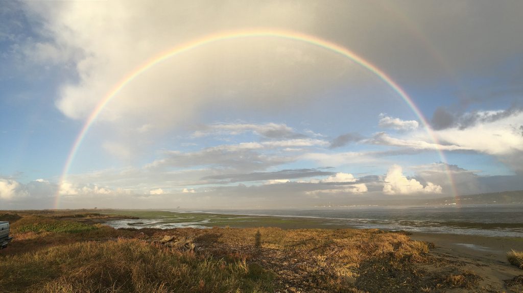 Full rainbow over the land