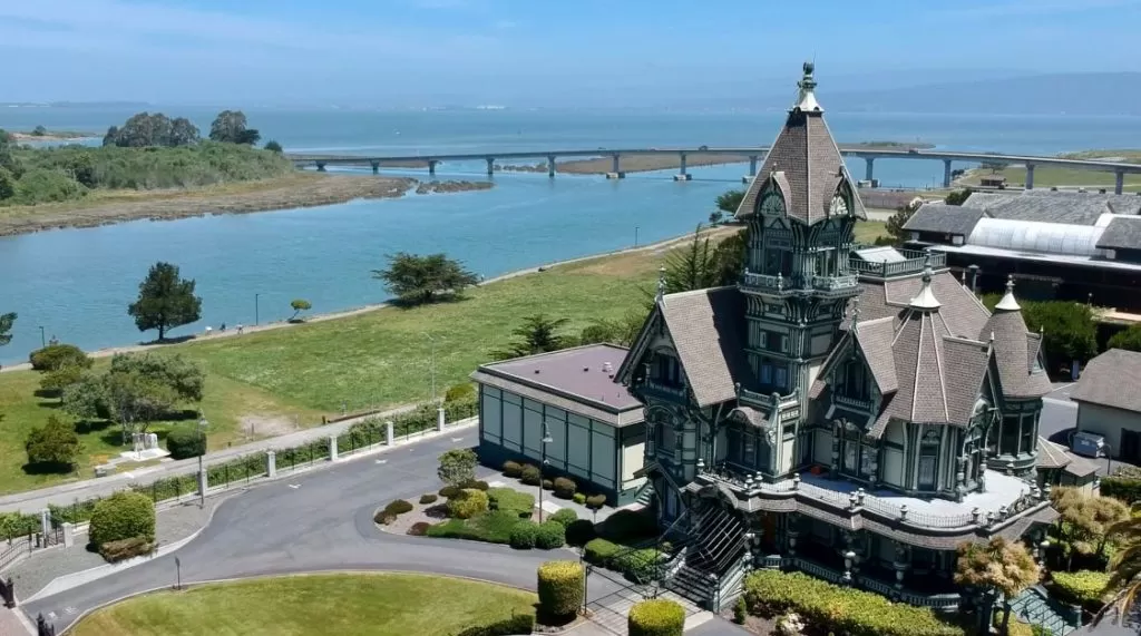 Birds-eye view of Carson Mansion overlooking the water